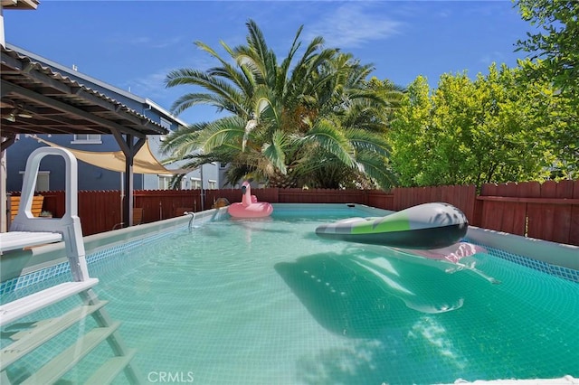 view of pool featuring a fenced backyard