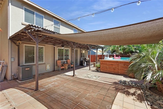 view of patio featuring fence, a pergola, cooling unit, and area for grilling