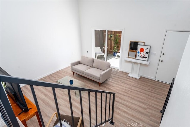 sitting room featuring wood finished floors and baseboards