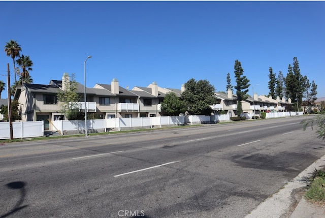 view of road with street lights and a residential view