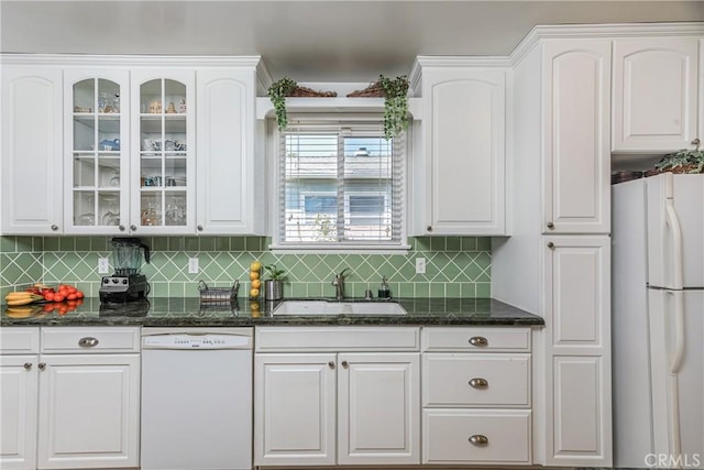 kitchen featuring glass insert cabinets, white appliances, white cabinetry, and a sink