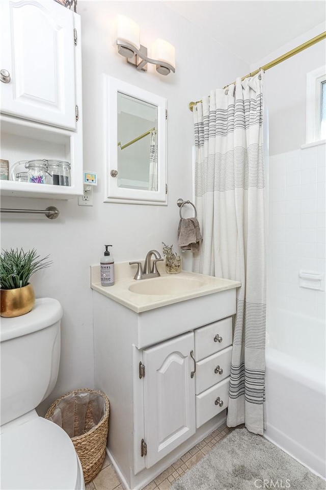 full bath with tile patterned flooring, vanity, toilet, and shower / tub combo with curtain