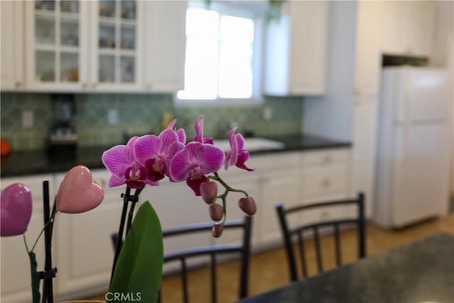 room details with backsplash and freestanding refrigerator