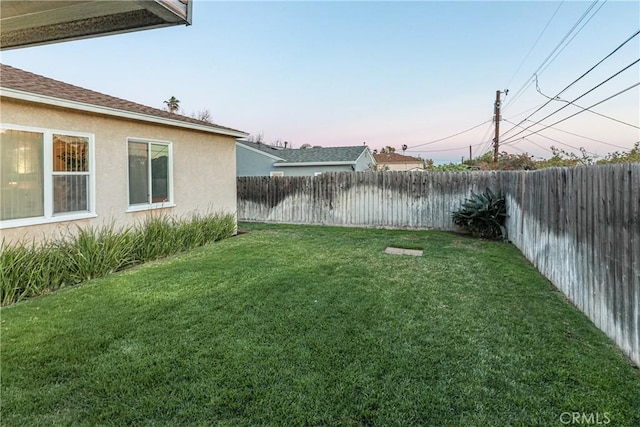 view of yard with a fenced backyard