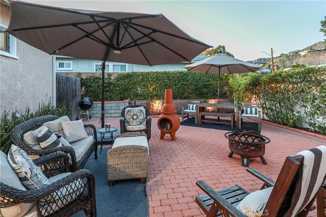 view of patio / terrace featuring an outdoor living space with a fire pit