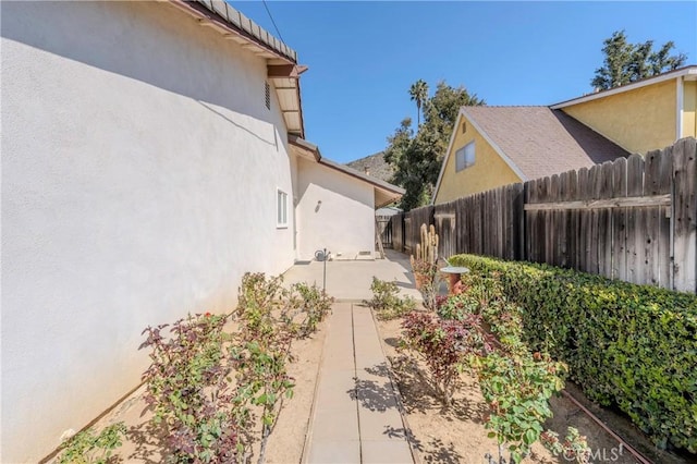 view of yard featuring a patio and fence