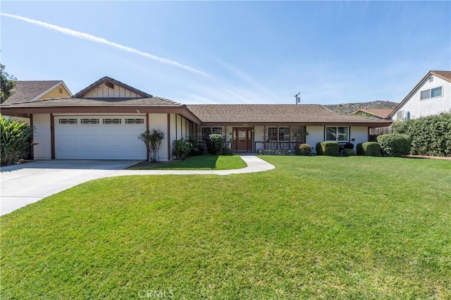 ranch-style house with concrete driveway, a front lawn, and a garage