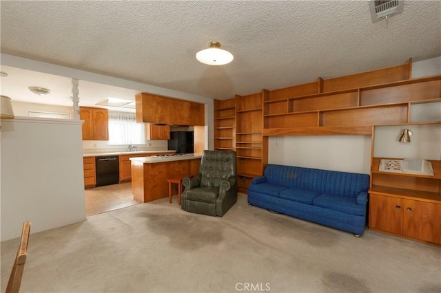 living room featuring light carpet, visible vents, and a textured ceiling