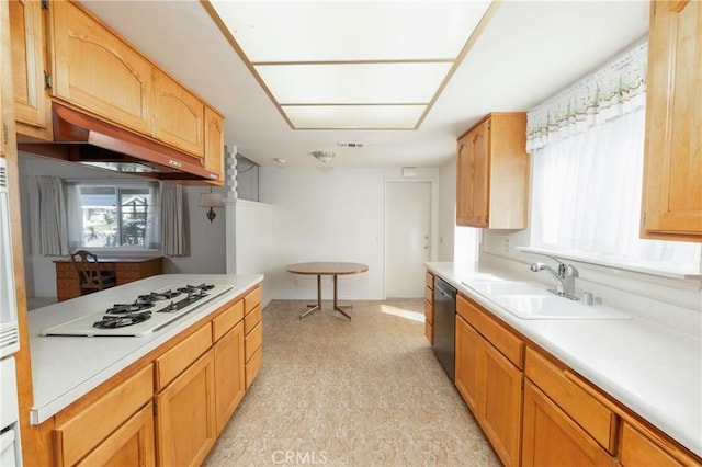 kitchen with a sink, dishwasher, light countertops, and white gas cooktop