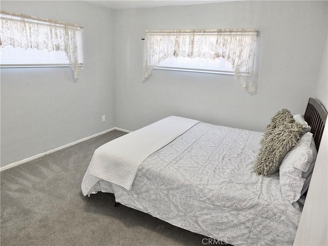 carpeted bedroom with baseboards