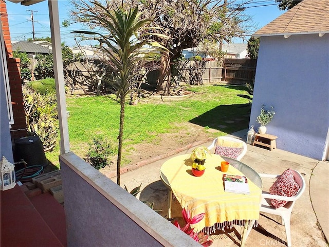 view of patio / terrace with outdoor dining area and a fenced backyard