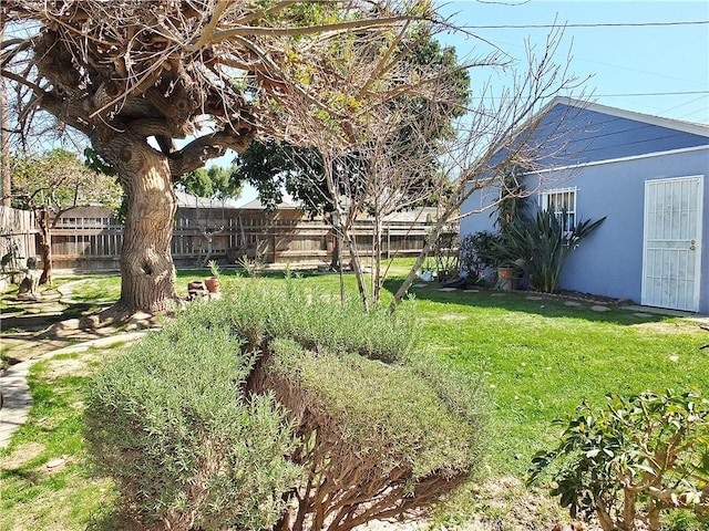 view of yard with a fenced backyard