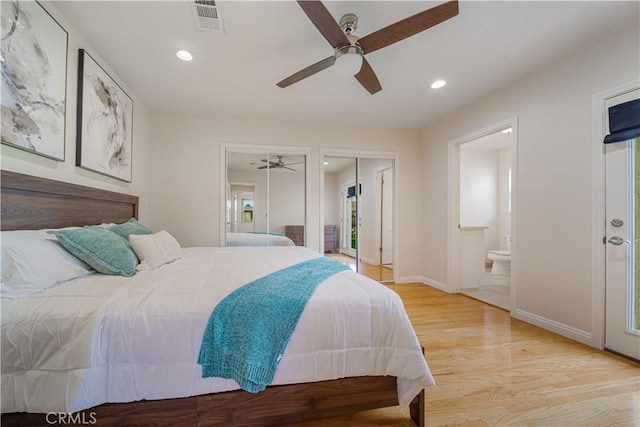 bedroom with two closets, recessed lighting, visible vents, light wood-style flooring, and connected bathroom