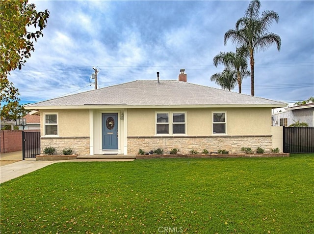 single story home featuring stone siding, fence, a front lawn, and stucco siding