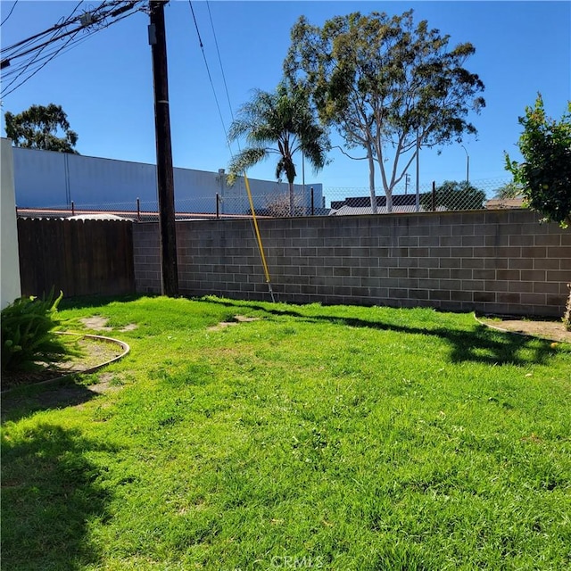 view of yard with a fenced backyard