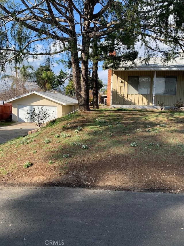 view of property exterior featuring fence and board and batten siding