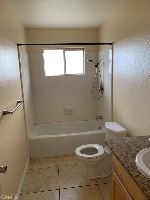 bathroom with vanity, shower / bath combination, tile patterned flooring, and toilet