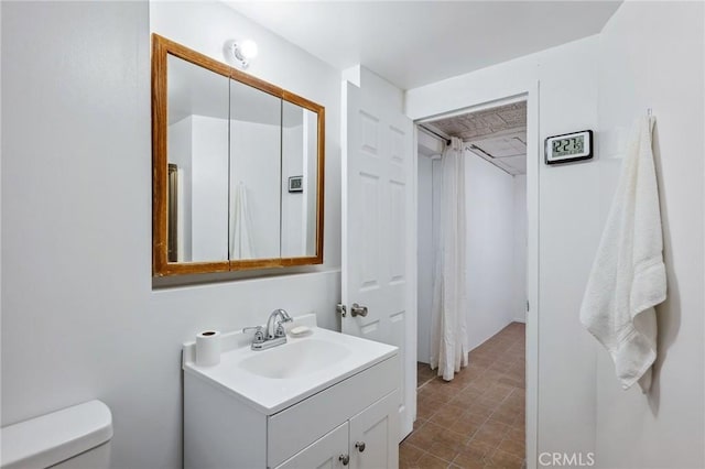 full bathroom featuring vanity and toilet