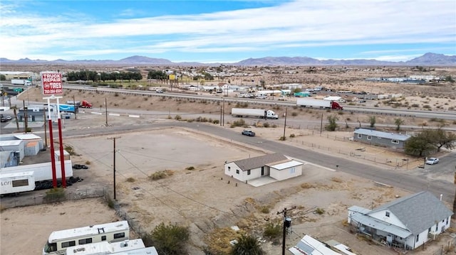 aerial view featuring a desert view and a mountain view