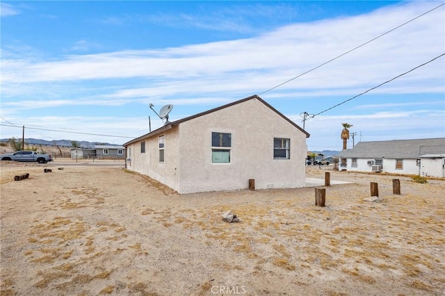 view of property exterior with stucco siding