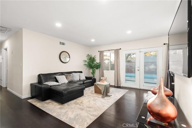 living area featuring recessed lighting, french doors, visible vents, and dark wood finished floors