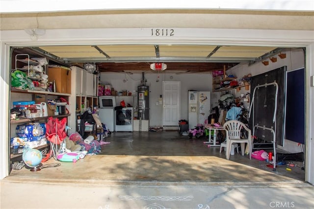 garage featuring white fridge with ice dispenser, water heater, and a garage door opener