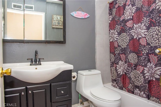 full bathroom with toilet, shower / bath combo, visible vents, and vanity