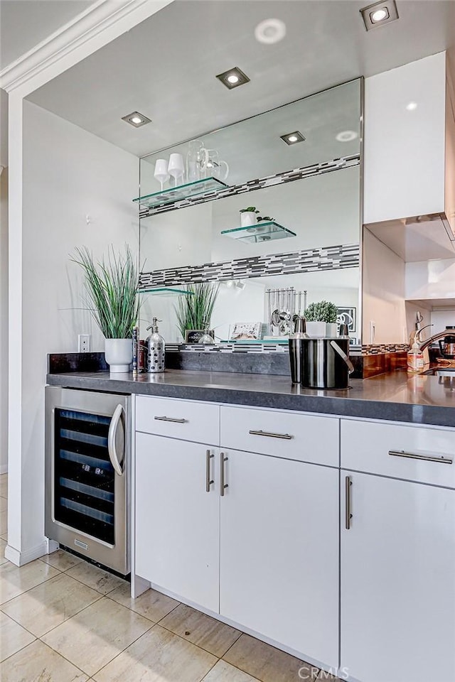 bar featuring recessed lighting, beverage cooler, and indoor wet bar