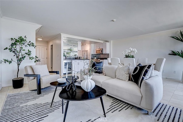 living room featuring wine cooler, crown molding, light tile patterned floors, recessed lighting, and baseboards