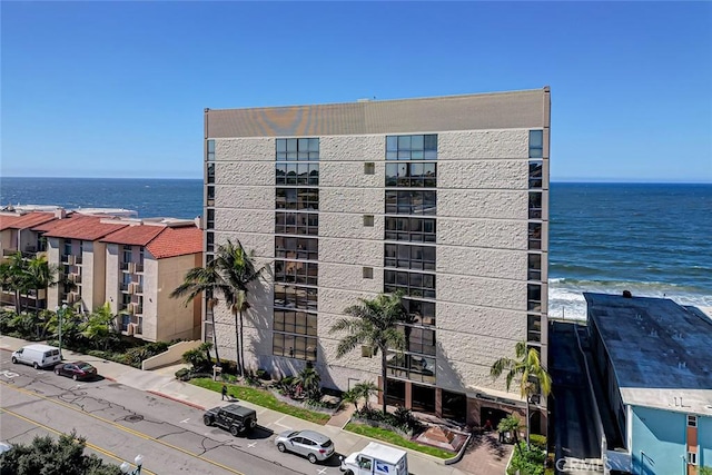 view of building exterior with a water view