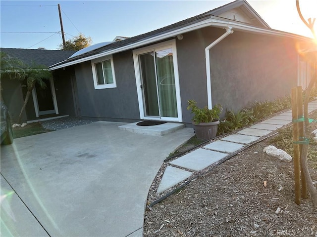 view of home's exterior featuring a patio area and stucco siding