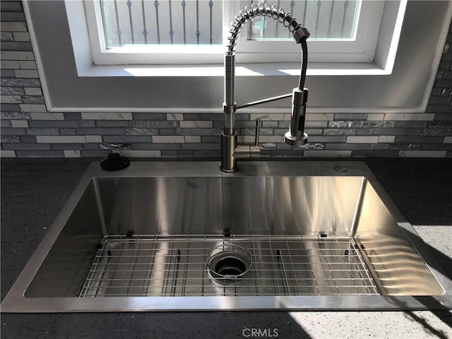 details with backsplash and a sink