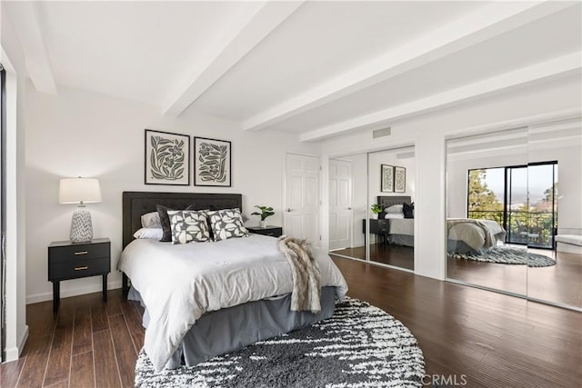 bedroom featuring access to exterior, visible vents, wood finished floors, beamed ceiling, and baseboards