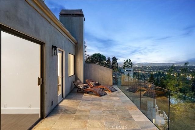 view of patio featuring a balcony