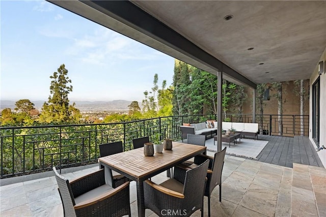 view of patio with an outdoor living space and outdoor dining space