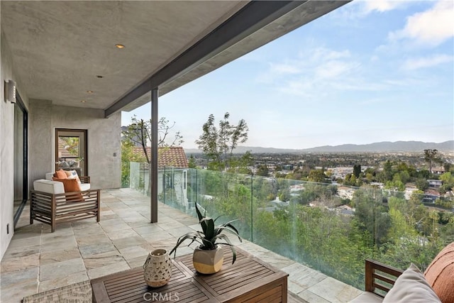 balcony featuring a mountain view