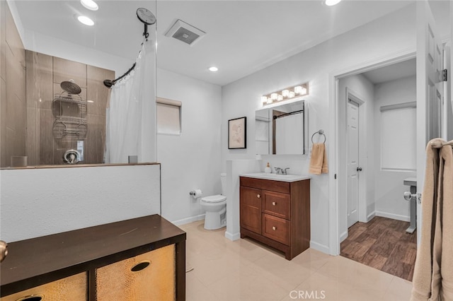 bathroom featuring curtained shower, toilet, recessed lighting, vanity, and visible vents