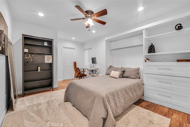 bedroom featuring a ceiling fan, recessed lighting, and wood finished floors