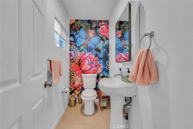 bathroom with tile patterned flooring and toilet