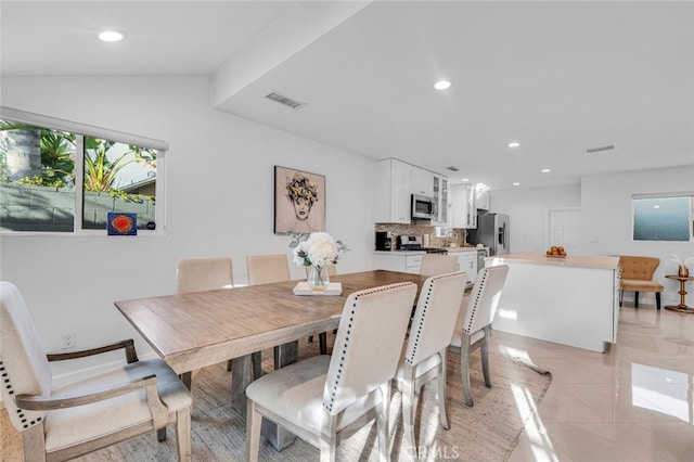 dining area featuring light tile patterned floors, visible vents, and recessed lighting