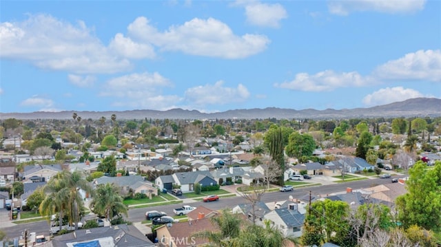 drone / aerial view with a residential view and a mountain view