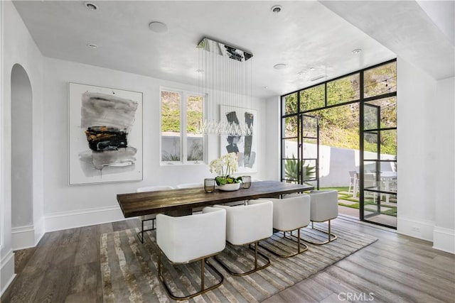 interior space with arched walkways and a wealth of natural light