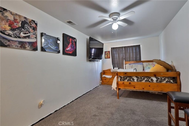 carpeted bedroom featuring ceiling fan and visible vents