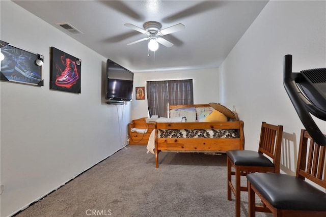 carpeted bedroom featuring visible vents