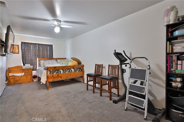 carpeted bedroom featuring visible vents