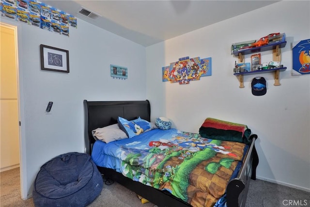 bedroom with baseboards, visible vents, and carpet flooring