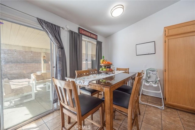 dining area with light tile patterned flooring