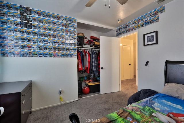 bedroom with ceiling fan, a closet, carpet, and baseboards