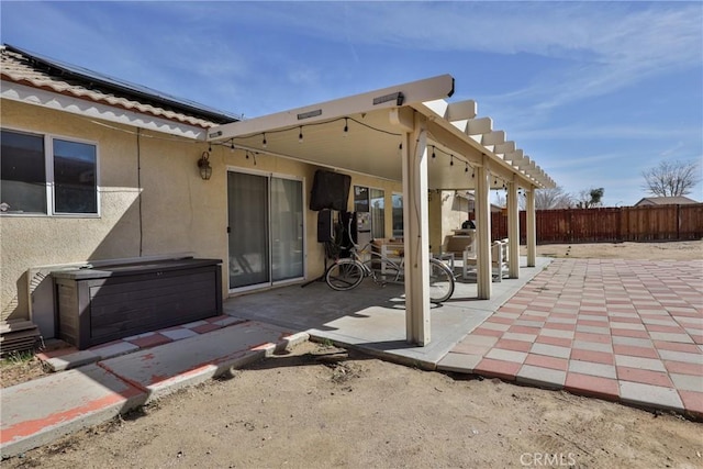 view of patio featuring fence