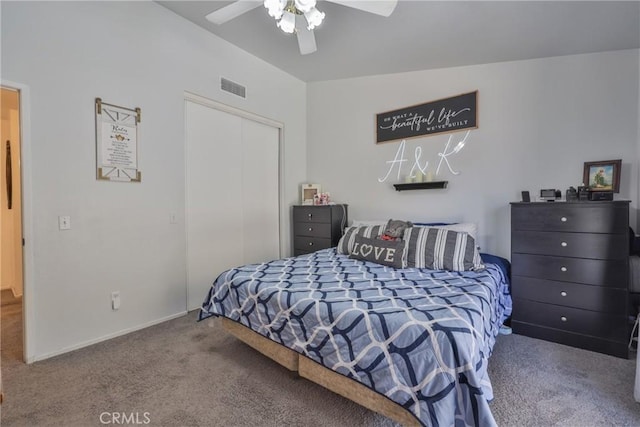 bedroom with baseboards, visible vents, ceiling fan, carpet, and a closet